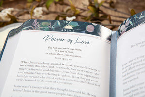 Open book with a decorative page marker on a natural background