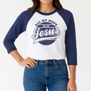 Woman wearing a blue and white baseball shirt with 'All My Hope Is in Jesus' text.
