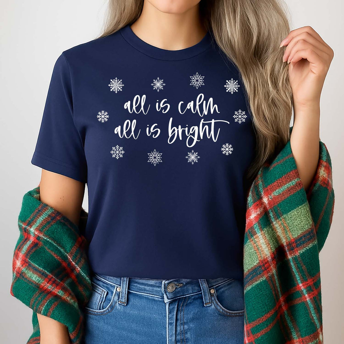 All is calm all is bright navy blue Christmas shirt worn by a woman in jeans