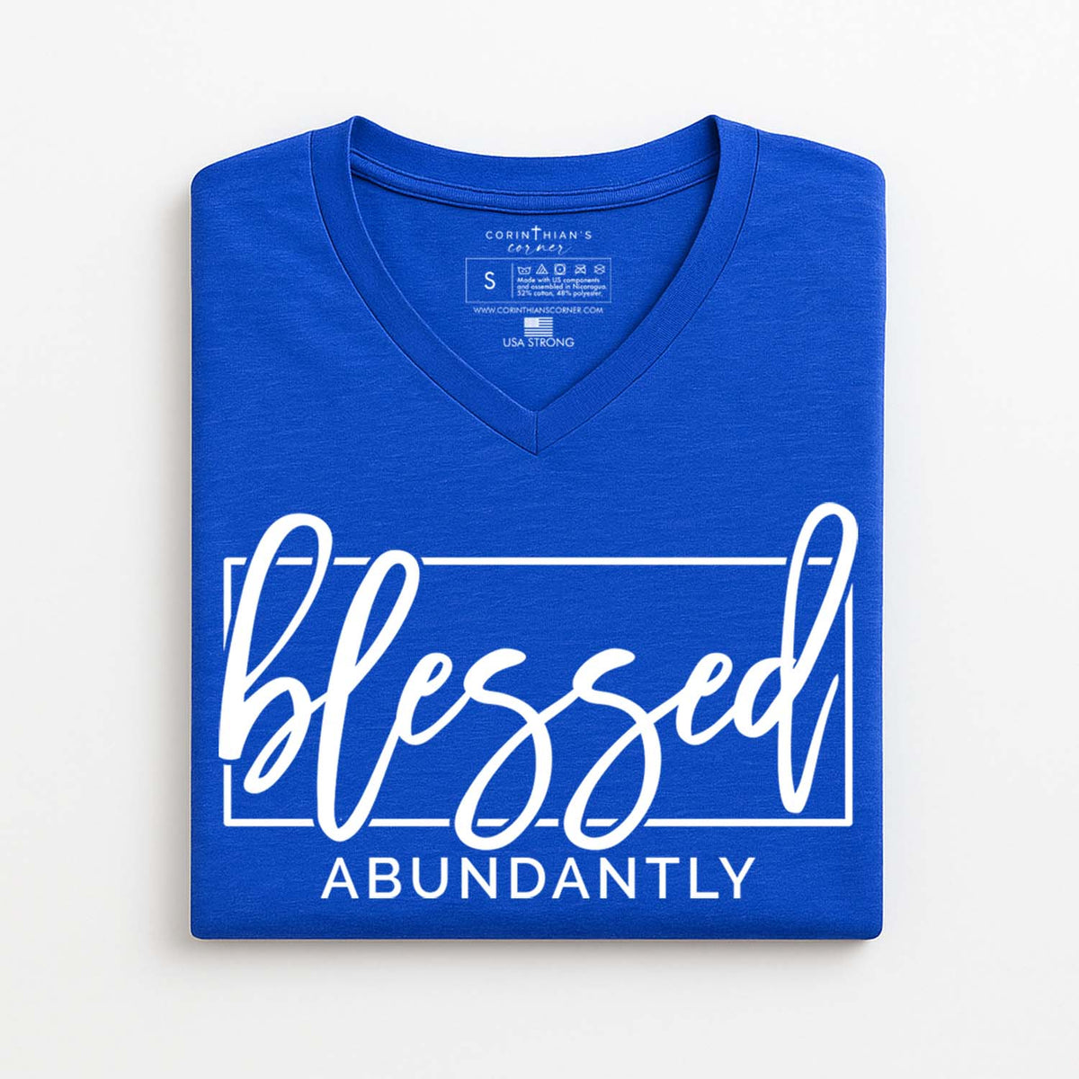 Blue t-shirt with 'blessed abundantly' text on a white background