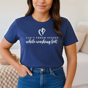 Can't throw stoens while washing feet navy blue Christian t-shirt worn by a young woman