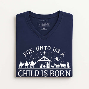 Navy blue V-neck t-shirt with white nativity scene design and text on a white background