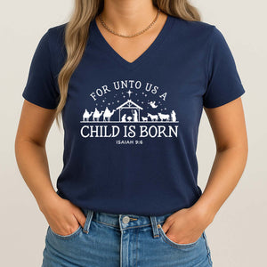 For unto us a child is born t-shirt with white nativity scene design and text worn by a woman