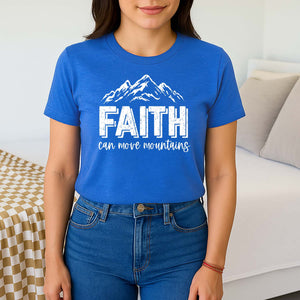 Woman wearing a blue t-shirt with 'FAITH can move mountains' text and mountain graphic.