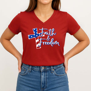 Person wearing a red t-shirt with 'Faith & Freedom' design on a plain background