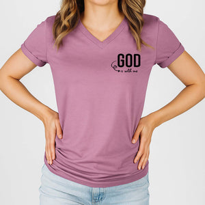 Person wearing a purple t-shirt with 'GOD is with me' text on a plain background