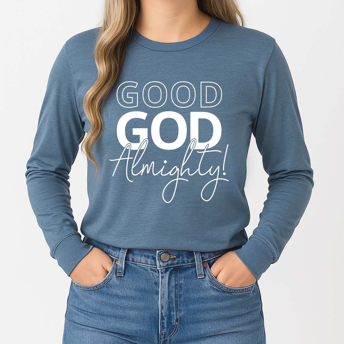 Young lady wearing a blue long sleeve shirt with a 'GOOD GOD Almighty!' design