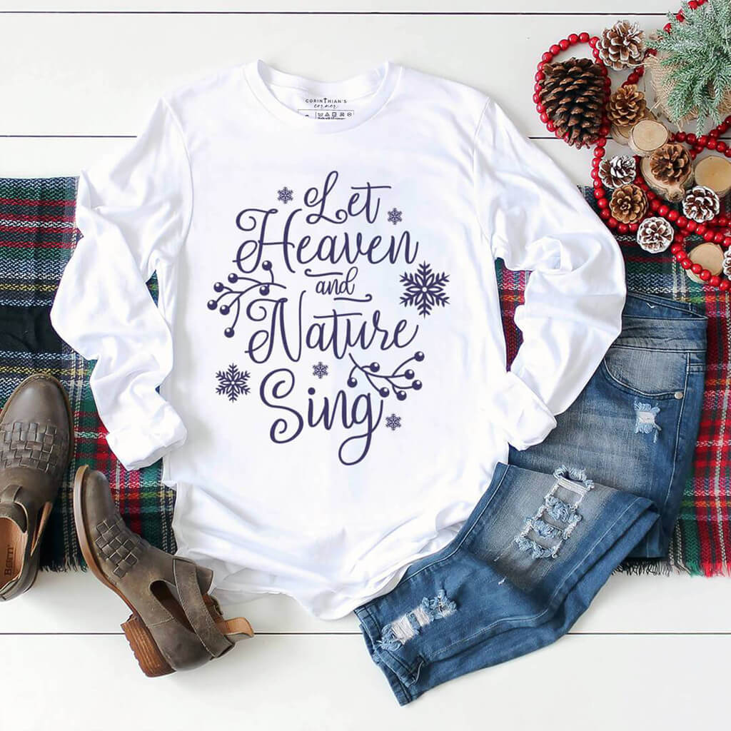 Bright white Christmas shirt that reads "let heaven and nature sing"