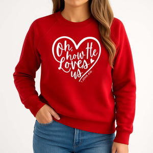 Red sweatshirt with white heart design and Bible verse from Book of John worn by a young woman