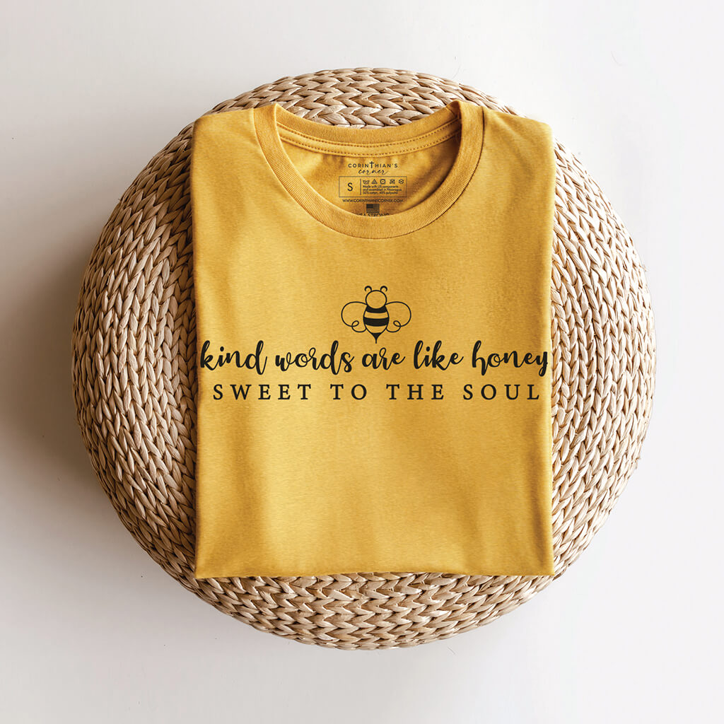 Kind words are like honey t-shirt folded to reveal Christian graphic