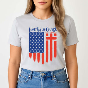 Smiling young woman wearing a patriotic liberty in Christ shirt referencing Galatians 5:1