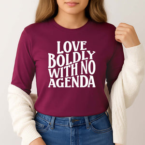 Woman wearing a maroon love boldly screenprinted long sleeve shirt