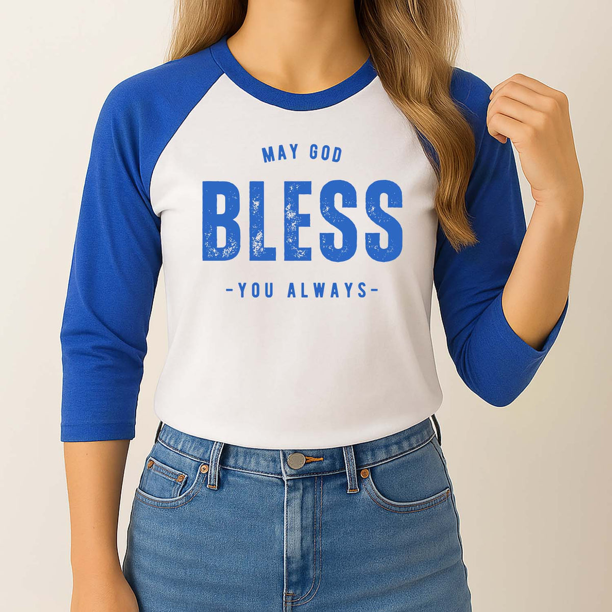 Woman wearing a blue and white baseball shirt with a faith-based design