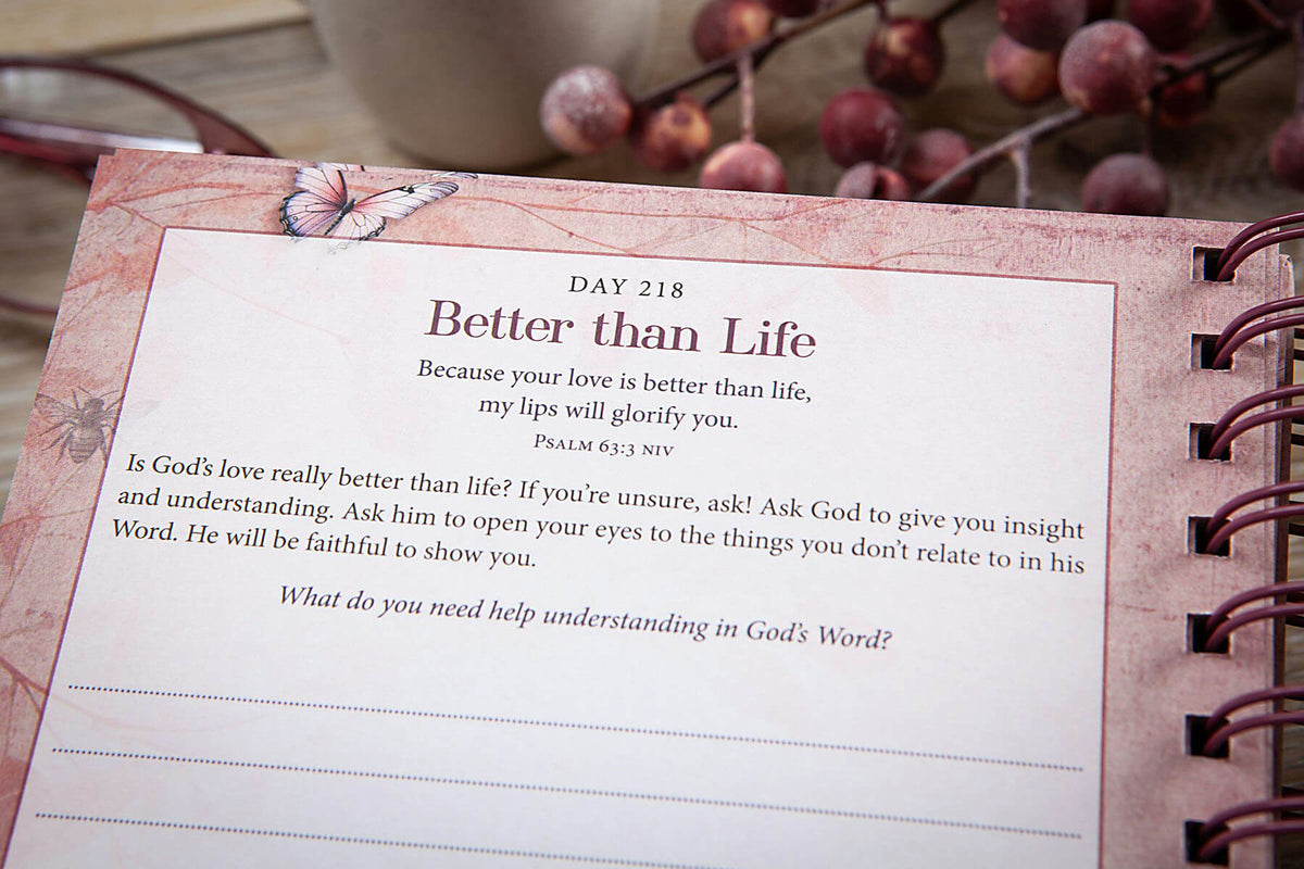 Notebook page with text and decorative elements on a wooden surface