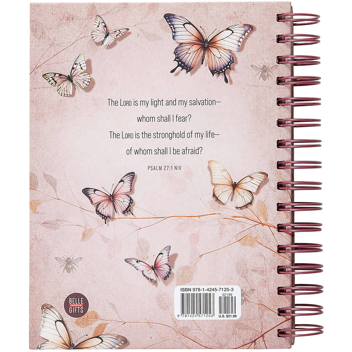A spiral-bound notebook or journal shown from the back, featuring a pale pink background with illustrated butterflies, a Bible verse from Psalm 27:1, a barcode, and a round 'Bible Bites' logo.
