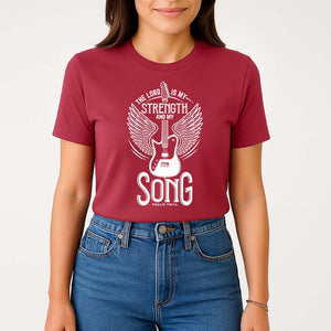 The Lord is my strength and my song rock-inspired t-shirt on a smiling young woman
