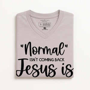 Folded light gray t-shirt with black text on a white background