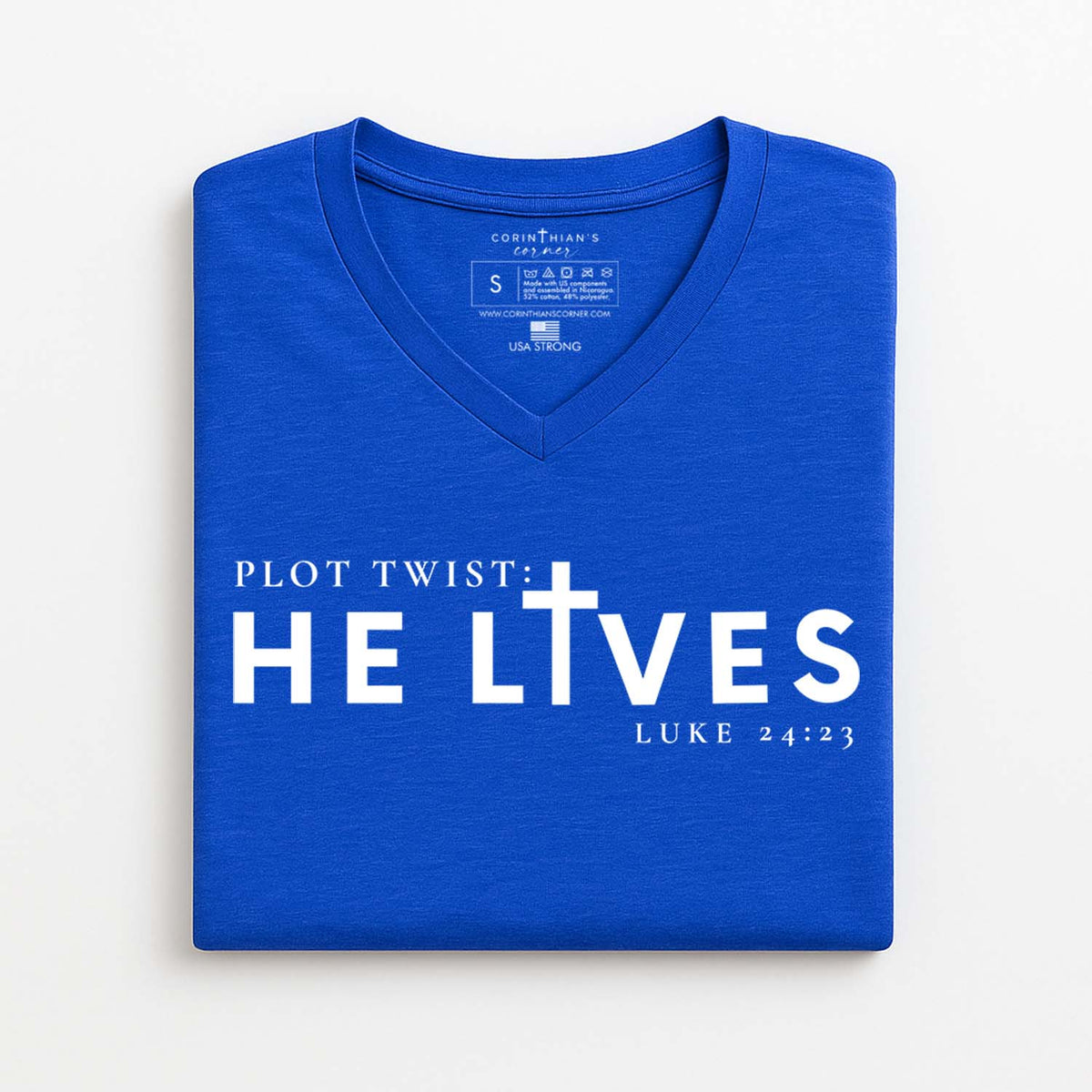 Blue V-neck t-shirt with 'PLOT TWIST: HE LIVES' text on a white background
