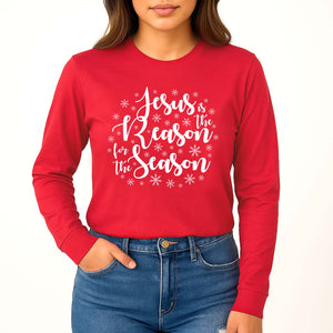 Red long-sleeve shirt with 'Jesus is the Reason for the Season' text and snowflakes, worn by a person.