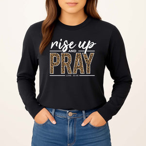 Black long-sleeve shirt with 'rise up and PRAY' text on a plain background