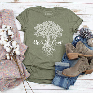 Olive green Christian top with a graphic tree of life design and rooted in Christ text