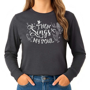 Dark grey shirt with 'Then Sings My Soul' text and musical notes worn by a young blonde woman