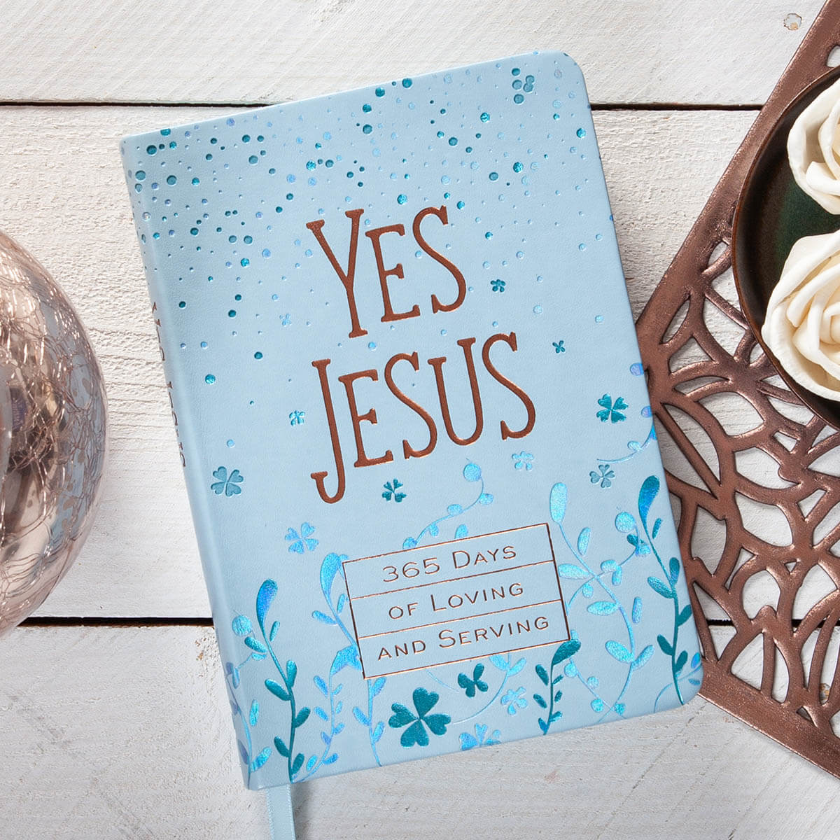 Daily devotional with 'Yes Jesus' text on a wooden surface