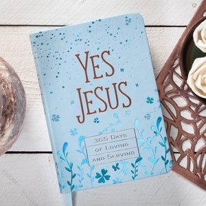 Daily devotional with 'Yes Jesus' text on a wooden surface
