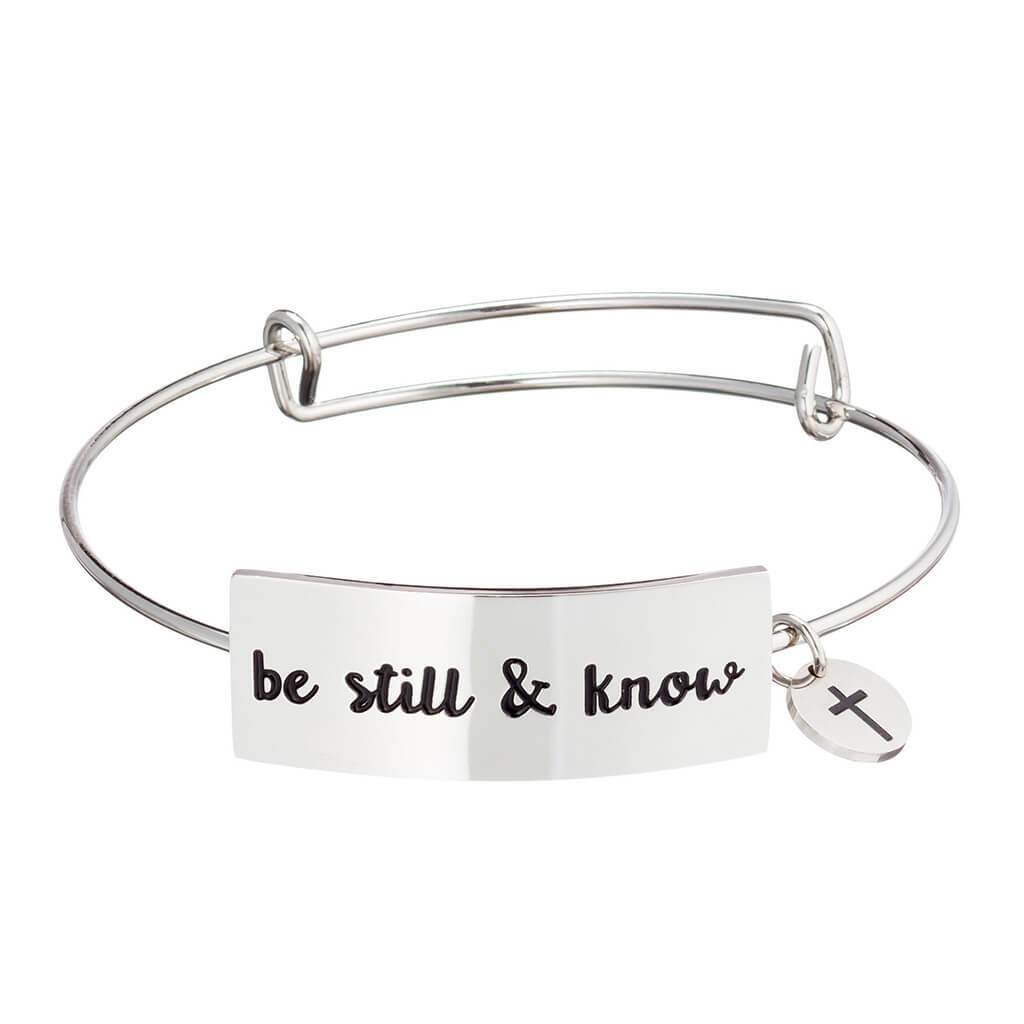 Stainless steel Christian bangle bracelet on white background