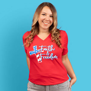 Size medium model wearing our faith and freedom v-neck