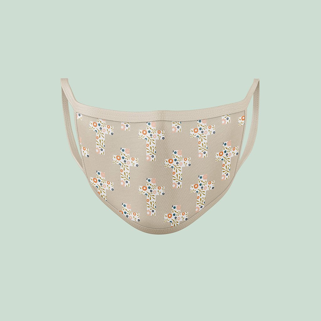Reusable cloth mask with a floral cross pattern printed on the front