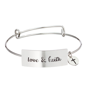 Stainless steel bracelet with horizontal plate that reads "love & faith"