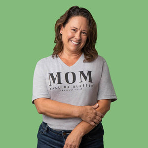Cheerful Christian mom wearing a Proverbs woman t-shirt design