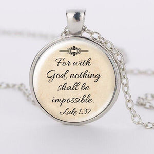 Luke 1:37 states "for with God, nothing shall be impossible" on a silver pendant necklace