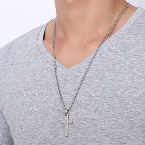Man in gray shirt wearing the stainless steel cross pendant necklace