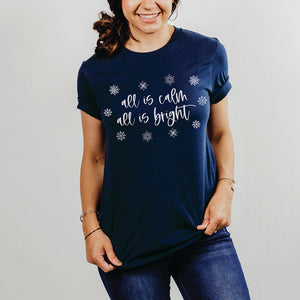 All is calm all is bright navy blue Christmas shirt worn by a woman in jeans