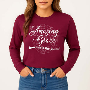 Red long sleeve shirt with 'Amazing Grace, how sweet the sound' worn by a young woman
