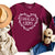 Uplifting Christian long sleeve shirt in maroon that reads choose joy