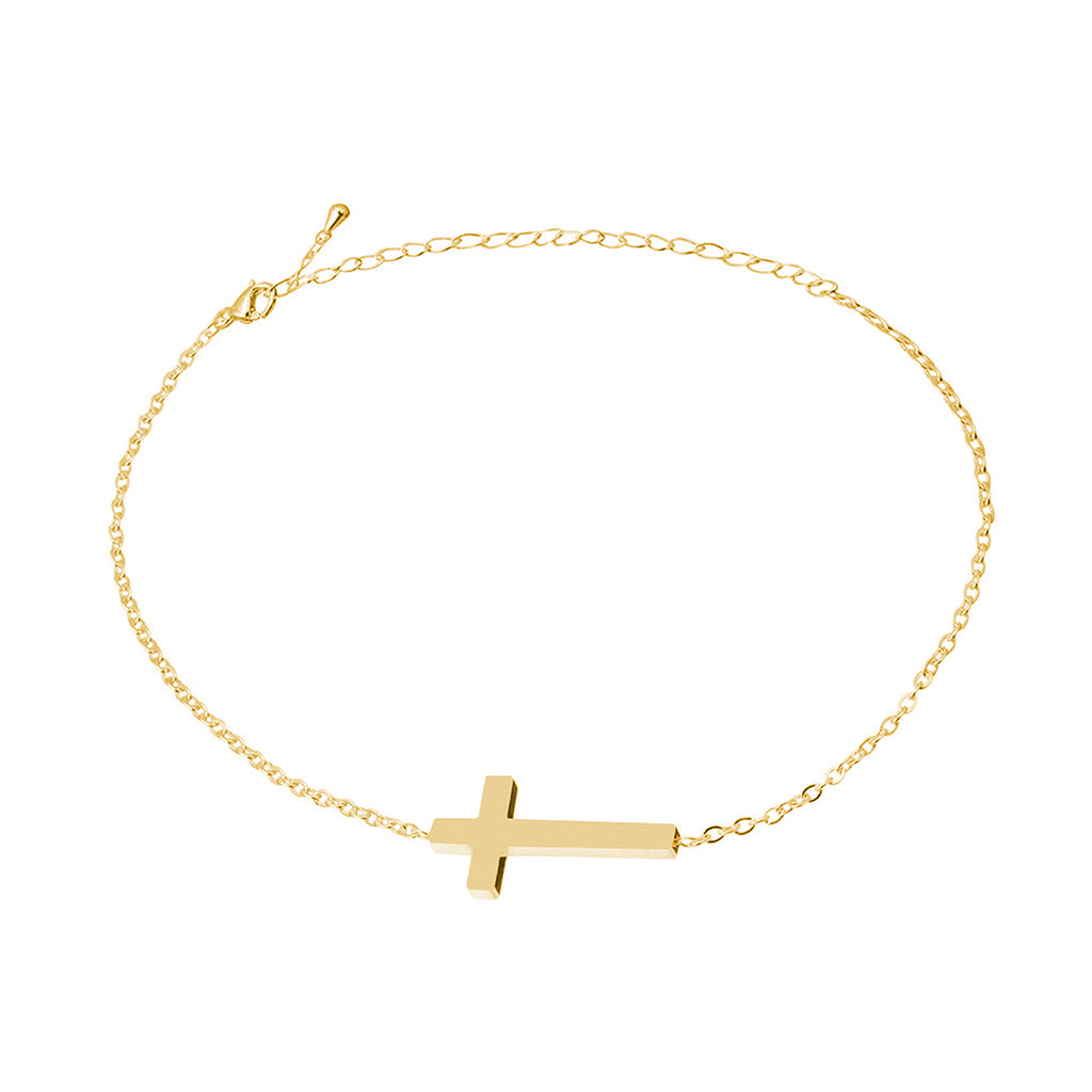 Dainty gold cross chain bracelet with lobster clasp laid out in a circle