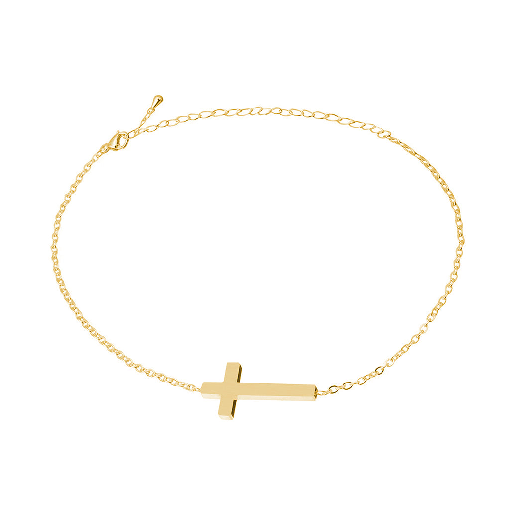Dainty gold cross chain bracelet with lobster clasp laid out in a circle
