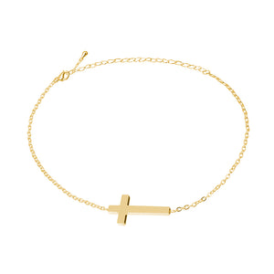 Dainty gold cross chain bracelet with lobster clasp laid out in a circle