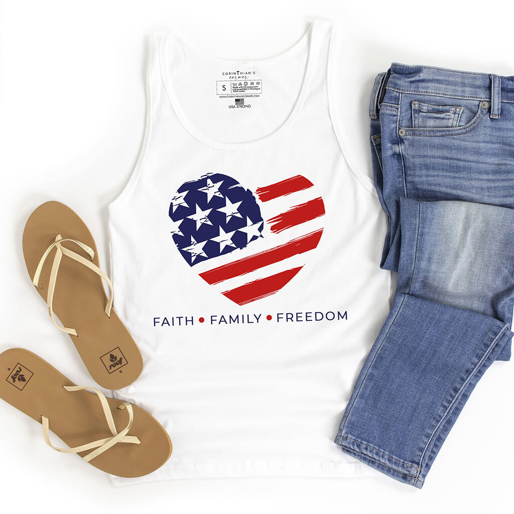 An American flag design inside of a heart shape printed on a white tank top