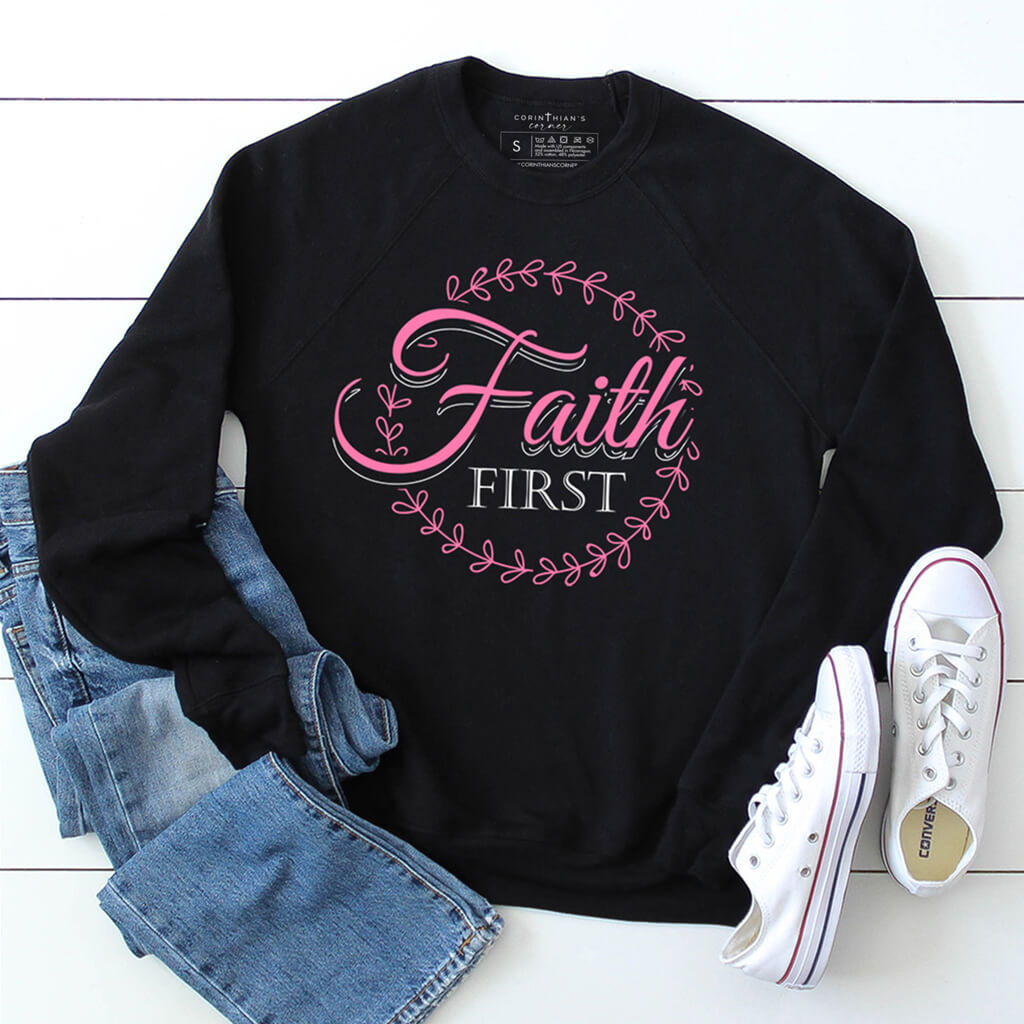 Christian sweatshirt with premium fleece that reads faith first in white and pink
