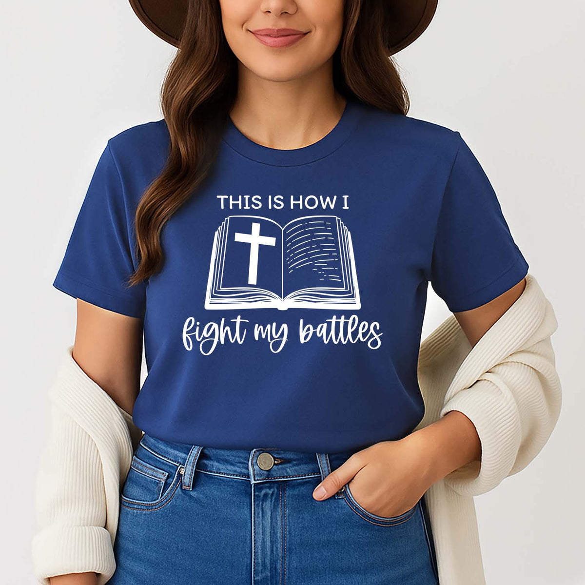 'This is how I fight my battles' navy t-shirt with Bible graphic worn by a stylish young lady