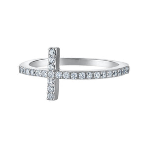 Close-up of a cross-shaped ring with sparkling CZ details