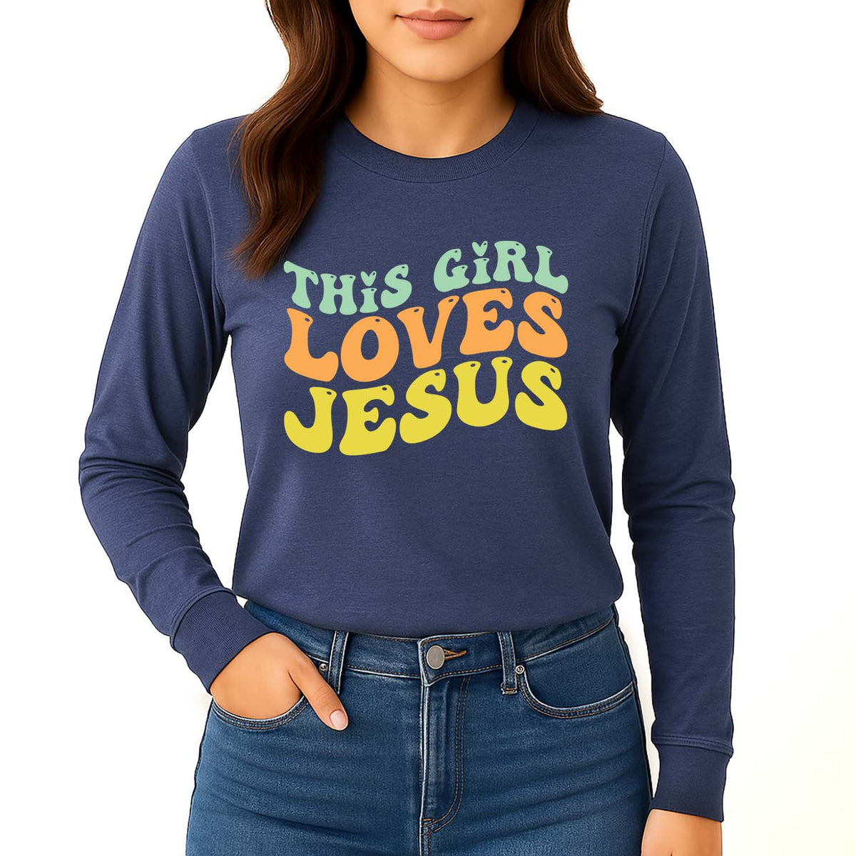 Navy blue long-sleeve shirt with colorful text that reads 'This Girl Loves Jesus'