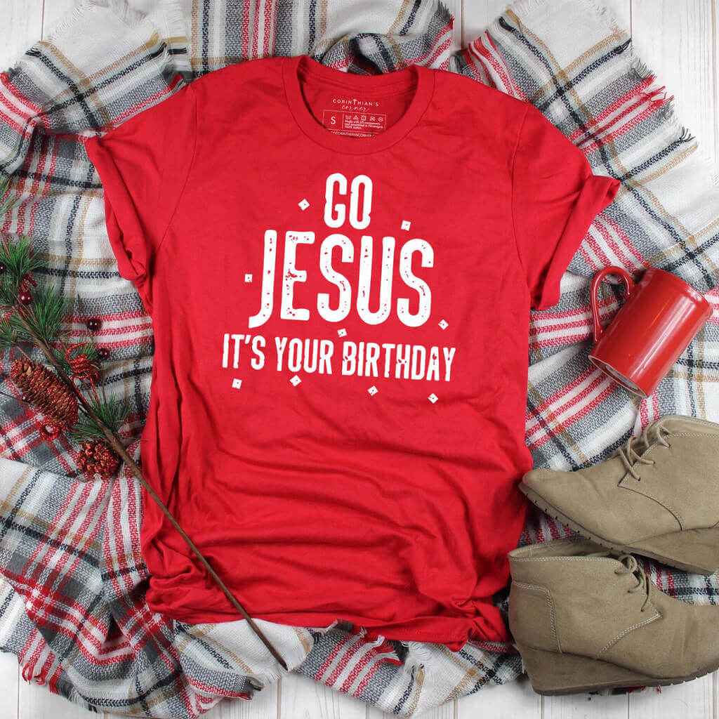 Lighthearted Christmas shirt in red that reads "Go Jesus, it's your birthday" with confetti