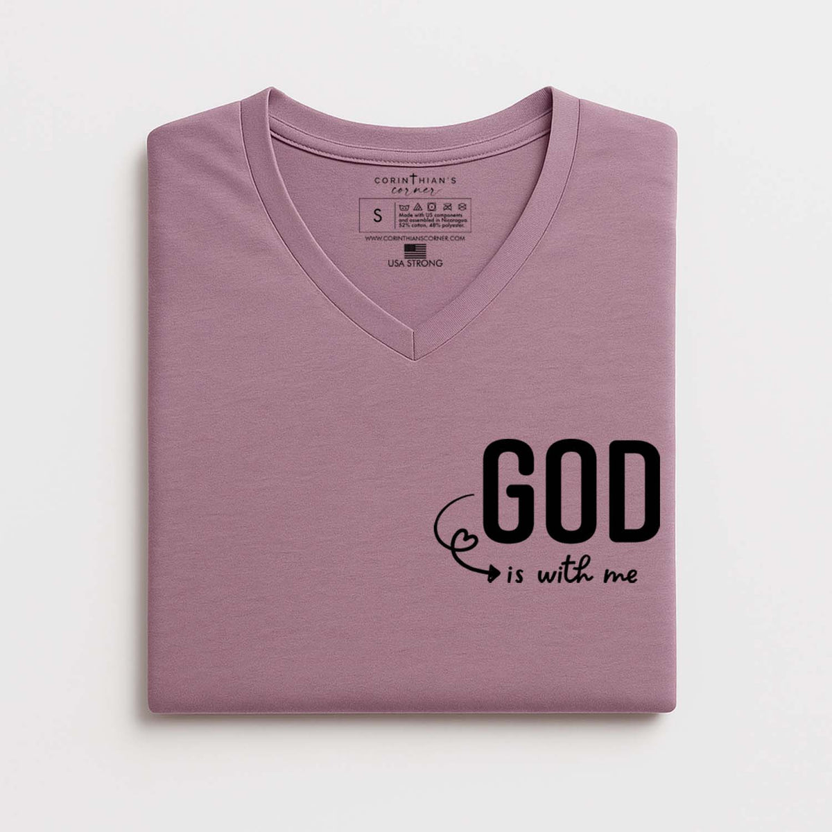Folded pink t-shirt with 'GOD is with me' text on a white background