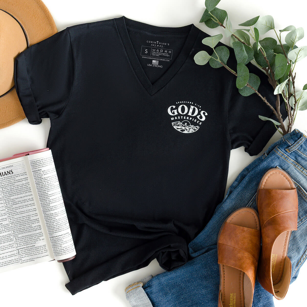 Ephesians Bible verse shirt on a black v-neck that reads God's masterpiece