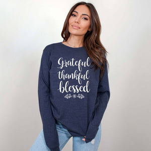 Size medium model wearing a long-sleeved grateful thankful blessed t-shirt for women